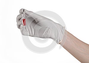 Doctor hand holding a vial, ampule red, vaccine ampule, Ebola vaccine, flu treatment, white background