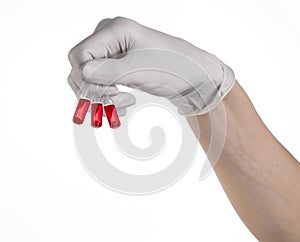 Doctor hand holding a vial, ampule red, vaccine ampule, Ebola vaccine, flu treatment, white background