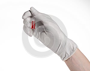 Doctor hand holding a vial, ampule red, vaccine ampule, Ebola vaccine, flu treatment, white background