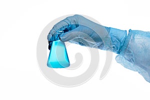 Doctor hand holds retort with blue liquid - isolated photo on a white background. Chemical flask  in a scientist hand in blue  glo
