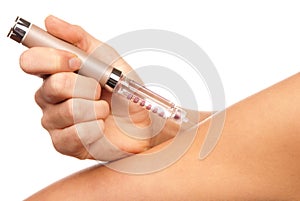 Doctor hand injecting medical insulin syringe pen photo