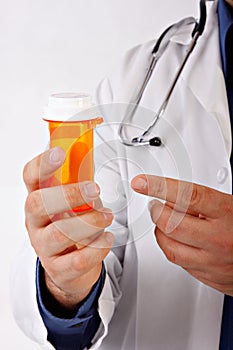 Doctor Hand Pointing to Empty Pill Bottole