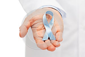 Doctor hand with prostate cancer awareness ribbon