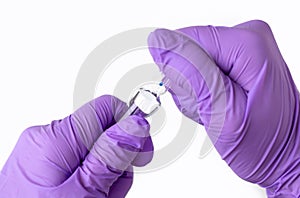 doctor hand in surgical gloves holding detach one anal or vaginal rectal suppositories anti fever virus constipation
