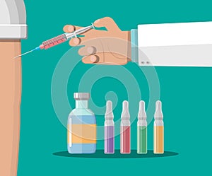 Doctor hand with syringe, vaccination of patient.