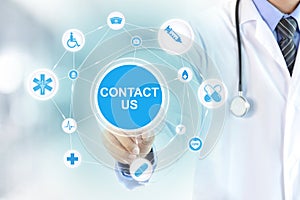 Doctor hand touching CONTACT US sign on virtual screen