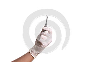 Doctor hand in white latex sterile gloves with forceps isolated