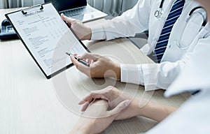 The doctor hand write report and explained the health examination results to the patient, medical checkup concept