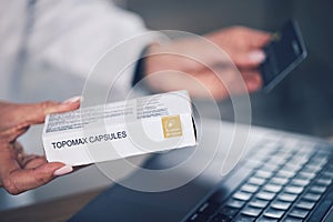 Doctor, hands and box with credit card for payment, medication or tablets at pharmacy or hospital. Closeup of woman