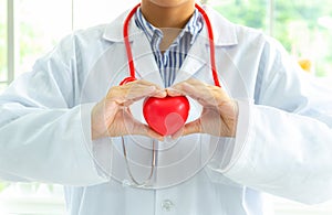 Doctor in hands giving red heart, love and health medical and insurance concept