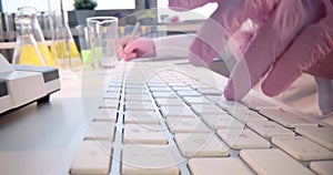 Doctor hands in gloves are typing on keyboard closeup