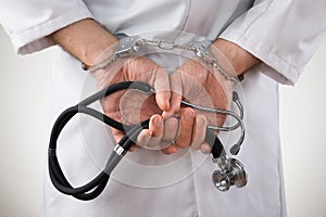 Doctor Hands In Handcuffs