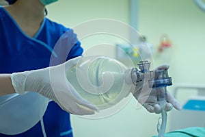 Doctor hands holding resuscitation bag.