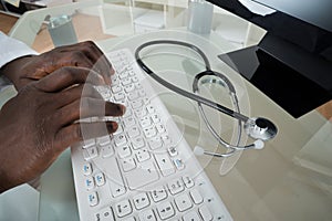 Doctor Hands Typing On Computer Keyboard