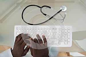 Doctor Hands Typing On Computer Keyboard