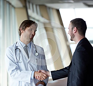 Doctor handshake with a patient