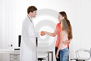 Doctor Handshaking Girl Mother