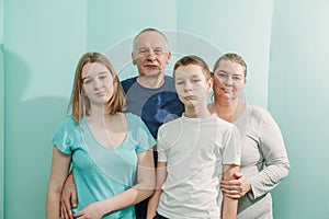 Doctor with happy family of mother father son and daughter at the hospital medical healthcare