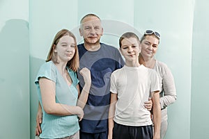 Doctor with happy family of mother father son and daughter at the hospital medical healthcare