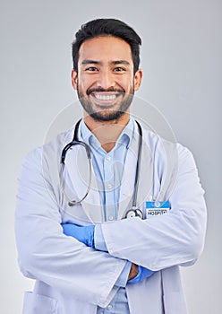 Doctor, happy man and portrait in a studio with a smile from success, motivation and stethoscope. Happiness, medical