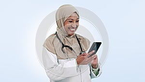 Doctor, happy woman and phone for healthcare communication, social media meme and telehealth services in studio. Muslim
