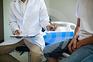 doctor is having consultation discussing prostate cancer and venereal cancer detected in young man. Current doctors provide advice
