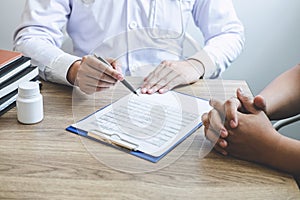 Doctor having conversation with patient while discussing explaining symptoms or counsel diagnosis health and consult treatment of