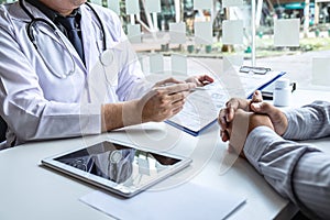 Doctor having conversation with patient while discussing explaining symptoms or counsel diagnosis health and consult treatment of photo