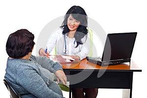 Doctor having conversation with patient in office