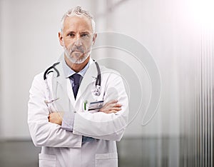 Doctor, healthcare and portrait of a serious man in a hospital with mockup space for health insurance. Professional male