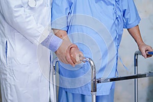 Doctor help and care Asian senior or elderly old lady woman use walker