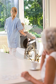 Doctor helping elder lady