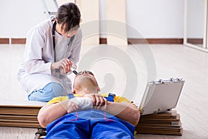 The doctor helping injured worker at construction site