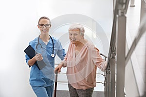 Doctor helping senior patient in hospital