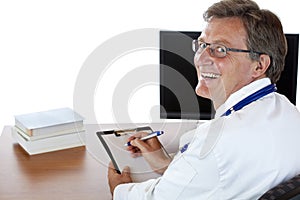 Doctor at his desk writes medical record