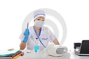 Doctor in his office behind a desk. photo