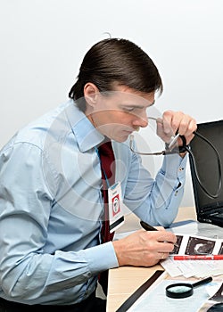 Doctor at his workplace at the table