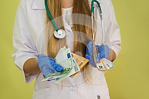 Doctor hold euro money   on green