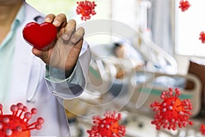 Doctor hold red heart and concept model covid 19 or coronavirus case of respiratory epidemic damage the lungs on blur  background photo
