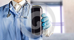 Doctor holding a beer can