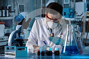 Doctor holding biological samples for analysis in the analysis l