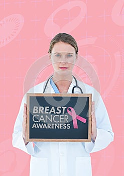 Doctor holding a blackboard with a breast cancer awareness ribbon