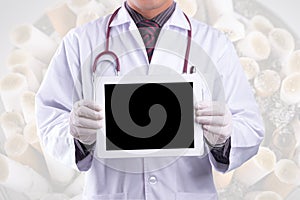 Doctor holding blank digital tablet with ashtray