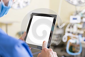 Doctor holding blank screen tablet