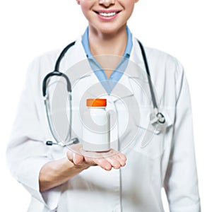 Doctor holding bottle of pills on white background. The concept of medicine, pharmacology, healthcare