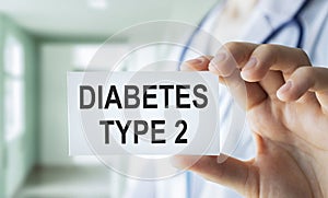 Doctor holding card in hands and pointing the word DIABETES TYPE 2