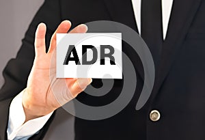 Doctor holding a card with text ADR Adverse drug reaction, medical concept