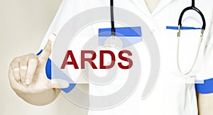 Doctor holding a card with text ARDS, medical concept