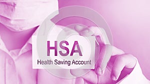 Doctor holding a card with text HSA Health Saving Account