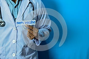 Doctor holding a card with text Mers Vaccine. Medical and healthcare concept